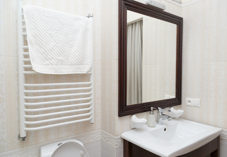 Minimalist beige marble tiled contemporary bathroom.の写真素材
