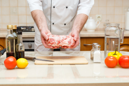 Man s hands holding beef piece, selective focusの写真素材