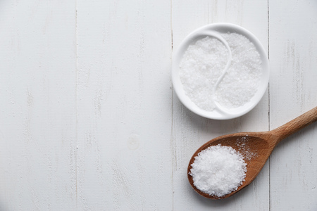 Sea salt on wood background. Top view and Copy space.の写真素材