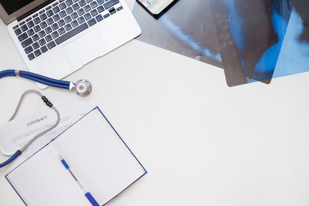 Conceptual workplace of a pulmonologist and a new contractの写真素材