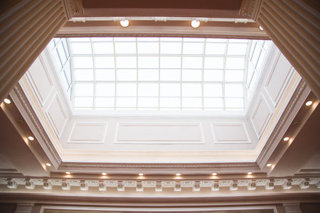 Structural glass facade curving roof of clasical building