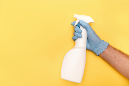 Cleaning Service Worker. Male hand with bottle of disinfectant.の写真素材