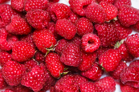 Fresh and sweet raspberries backgroundの写真素材
