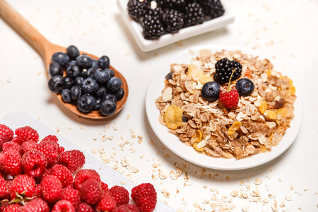 Healthy breakfast super food cereal concept with fresh fruits isolated on whiteの写真素材