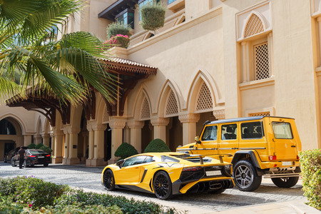 DUBAI, UAE - JANUARY 08, 2019: yellow luxury supercar Lamborghini Aventador Roadster and Gelandewagen in Dubai.のeditorial素材
