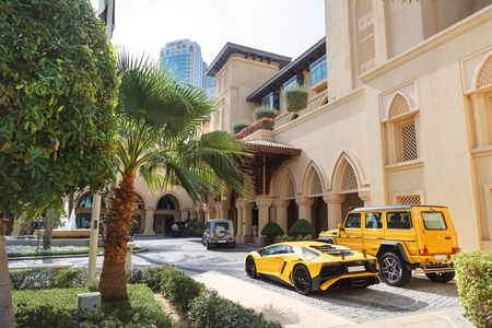 DUBAI, UAE - JANUARY 08, 2019: yellow luxury supercar Lamborghini Aventador Roadster and Gelandewagen in Dubai.のeditorial素材