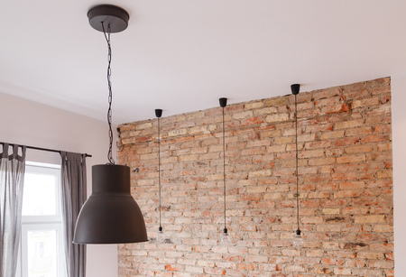 Loft style interior with lamps illuminationの写真素材