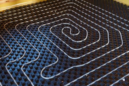 Underfloor heating pipes. Low temperature heating conceptの写真素材