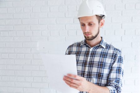 Construction renovation engineer reading documentsの写真素材