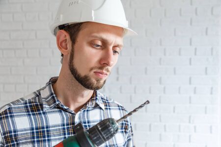 Repairman working with power drillの写真素材