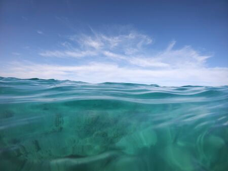 boundless seascape through the eyes of a swimmer in the open seaの写真素材