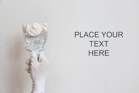 Putty the wall gypsum putty with spatulasの写真素材