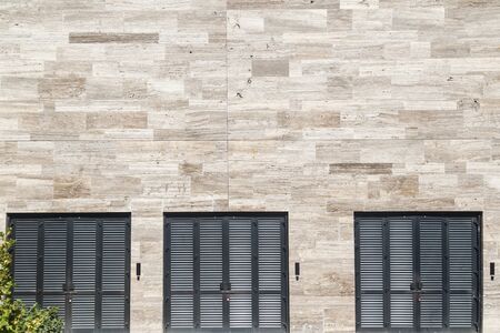 Modern facade of a business building with a metal gatesの写真素材