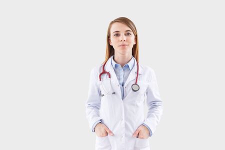 Young female doctor on isolated white background.の写真素材