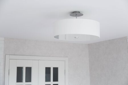 Suspended chandelier in a modern house interior.の写真素材