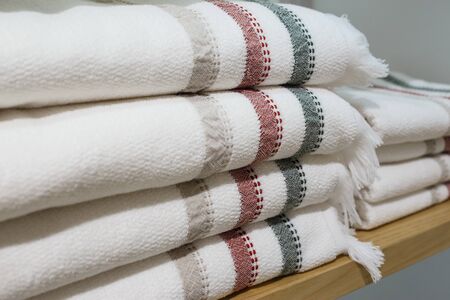 Shelves with towels stacks in shop. Hygge or another scandinavian styleの写真素材