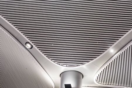 Abstract Metal construction. Metal ceiling in contemporary commercial building.の写真素材