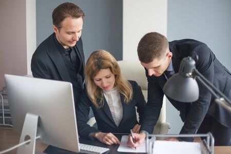 Business team at computer in the officeの写真素材