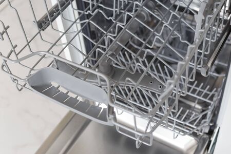 Shelf for plates in the dishwasher machine.の写真素材