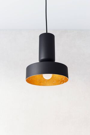 black metal pendant lights decorated inside by golden foil.の写真素材