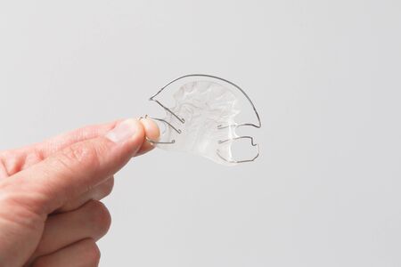 Orthodontic removable plate in hand.の写真素材