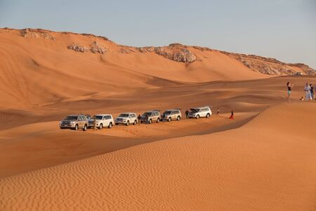 DUBAI, UAE - January 08, 2019: Motorcade of Toyota Land Cruiser cars in the desert during a safari near Dubaiのeditorial素材