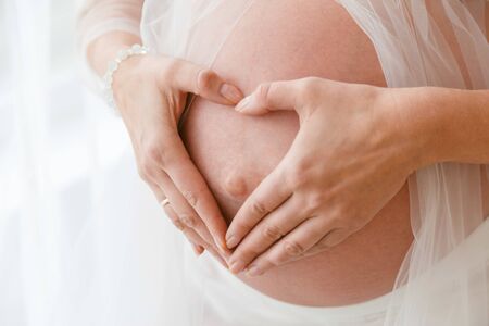 Close up of a cute pregnant belly.の写真素材