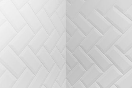 Internal angle of beveled white matt ceramic tiles pattern herringbone on wall
