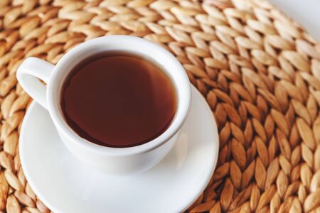 White cup of black tea on rustic.の写真素材