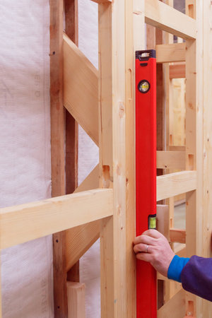 Accuracy and quality. Quality control of the construction of wooden building structures of a frame...