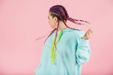 Girl with fashionable set of multicolored braids Kanekalon.の写真素材