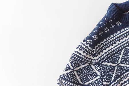 Wool man blue pullover with white pattern isolated at white backgroundの写真素材
