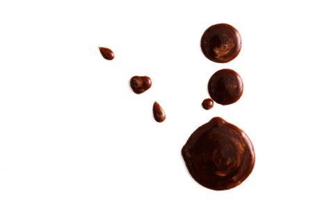 Close up chocolate stains on white background. Top view, isolated on whiteの写真素材