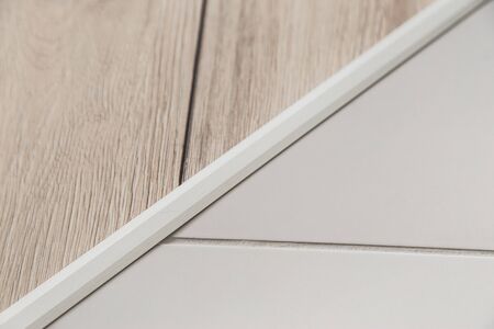 Aluminium platband for laminate and tile floor joints, floor connector, decorative strip or sillの写真素材