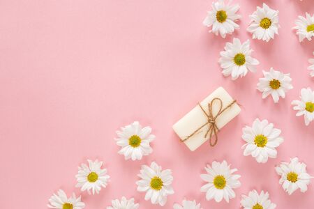 Flat lay composition with hand made soap bars and lavender flowers on violet backgroundの写真素材