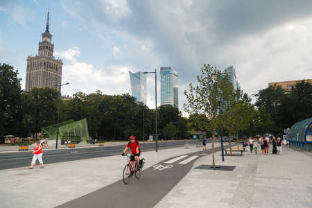 Warsaw, Poland - 2020/06/01: Alone people cycling along the city bike road in downtownのeditorial素材