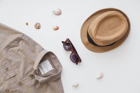 Fashionable concept, mens shirt and sunglasses isolated on white background. Flat lay, summer style conceptの写真素材