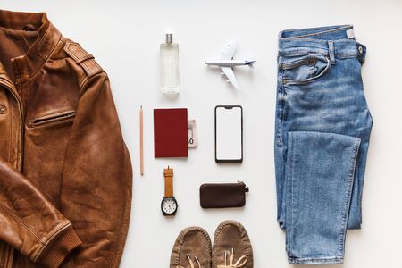 Casual male flat lay hipster summer fashion set of accessories and clothes on white. Copy space in center.の写真素材