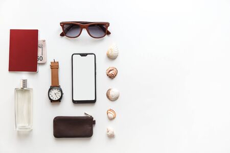 Male flat lay traveler accessories set isolated on white. Top view knollingの写真素材
