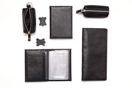 Fashionable black leather male accessories isolated on white background. Male accessories. Wallet, purse, key holder, business card holder. Top view, flat lay.の写真素材