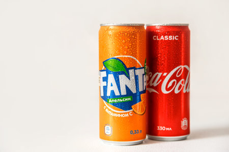 Minsk, Belarus - September 18, 2020: Coca-Cola and Fanta cans with with condensation drops on it....