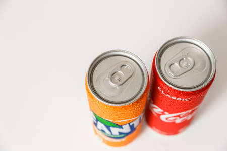 Minsk, Belarus - September 18, 2020: Coca-Cola and Fanta cans with with condensation drops on it. Two drinks produced by the Coca-Cola Companyのeditorial素材