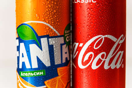 Minsk, Belarus - September 18, 2020: Coca-Cola and Fanta cans with with condensation drops on it. Two drinks produced by the Coca-Cola Companyのeditorial素材