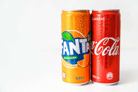 Minsk, Belarus - September 18, 2020: Coca-Cola and Fanta cans with with condensation drops on it. Two drinks produced by the Coca-Cola Companyのeditorial素材