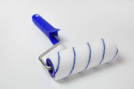 Paint roller isolated on whiteの写真素材