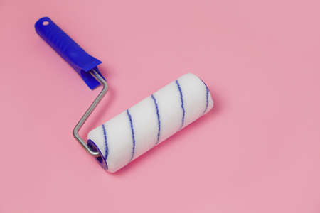 Paint roller isolated on pinkの写真素材