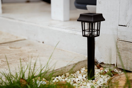 Solar-powered garden lamp in the daytime. Renewable eco energy in domestic lifeの写真素材