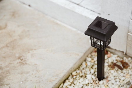 Solar-powered garden lamp in the daytime. Renewable eco energy in domestic lifeの写真素材