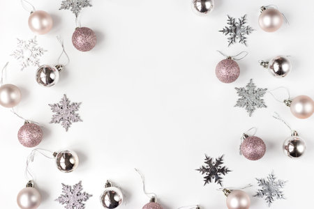 White and silver Christmas ornaments and gift on white background top view. Christmas and Holidays...