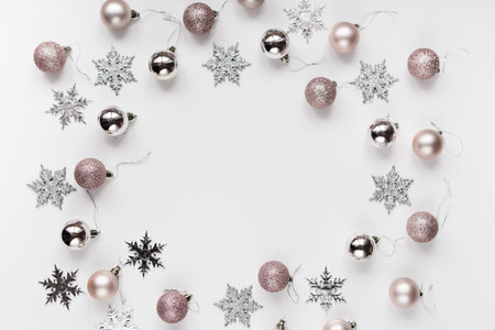 White and silver Christmas ornaments and gift on white background top view. Christmas and Holidays greeting card, frame, banner. new year. noel. Winter xmas holiday theme. flat layの写真素材